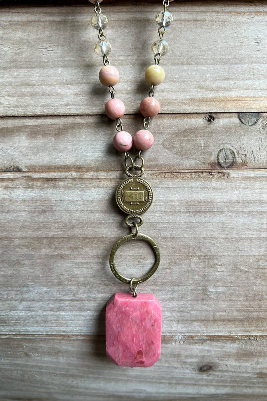 Lyssa necklace toggle ring and pink agate pendant on wood
