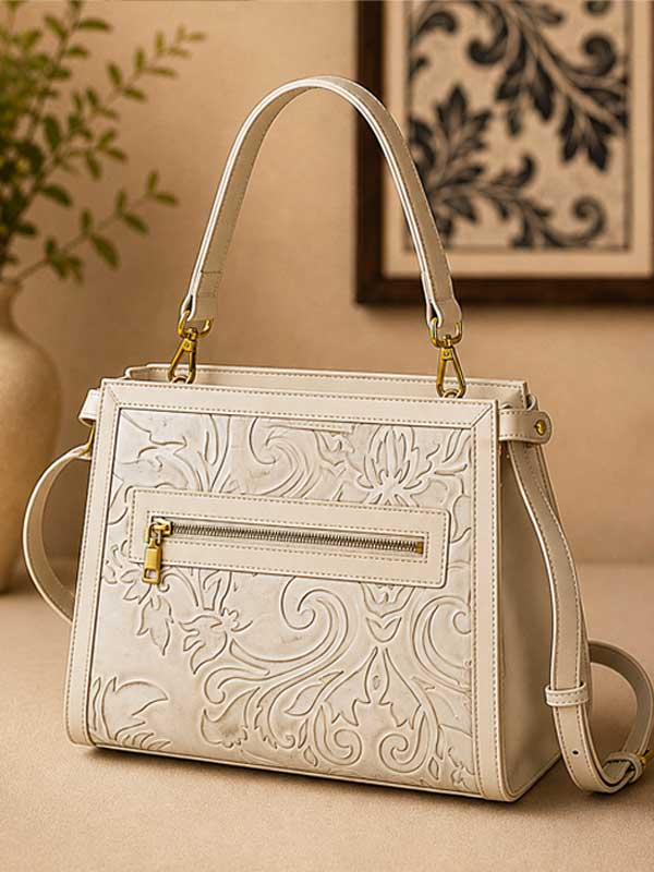 Mila satchel in the cream colorway showing the back zip pocket; this listing is chestnut brown
