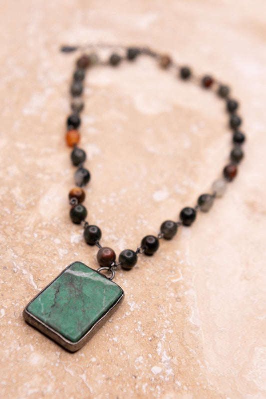 Suzanne jasper necklace laid flat, showing the beaded strand and pendant