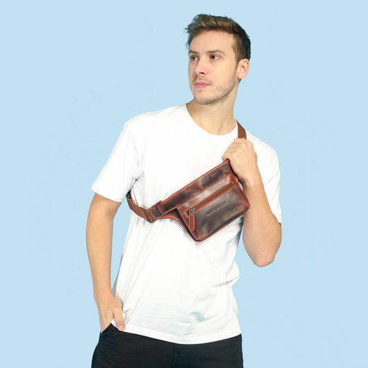 Man in a white tee wearing the chestnut Osaka leather belt bag crossbody