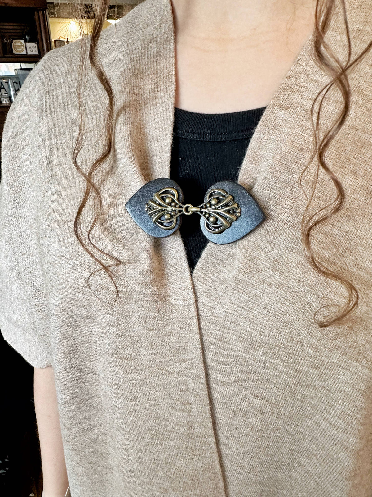 Same clip style in the slate blue-gray colorway on a knit cardigan; color example, this listing is dark brown