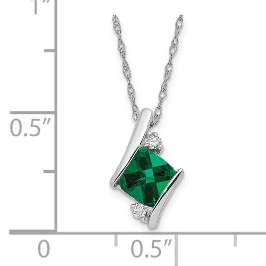 Emerald and diamond pendant necklace shown with inch scale reference