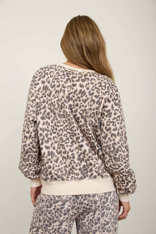 Back view of the leopard boxy knit top showing the cream ribbed hem and the square boxy cut