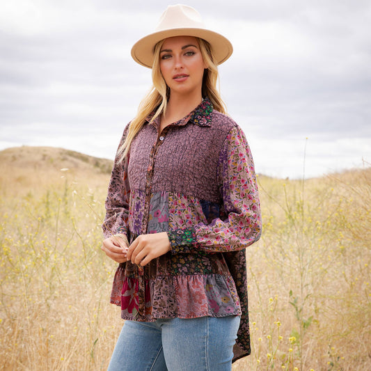 Model wearing the mulberry ruffle hem tunic outdoors, front view
