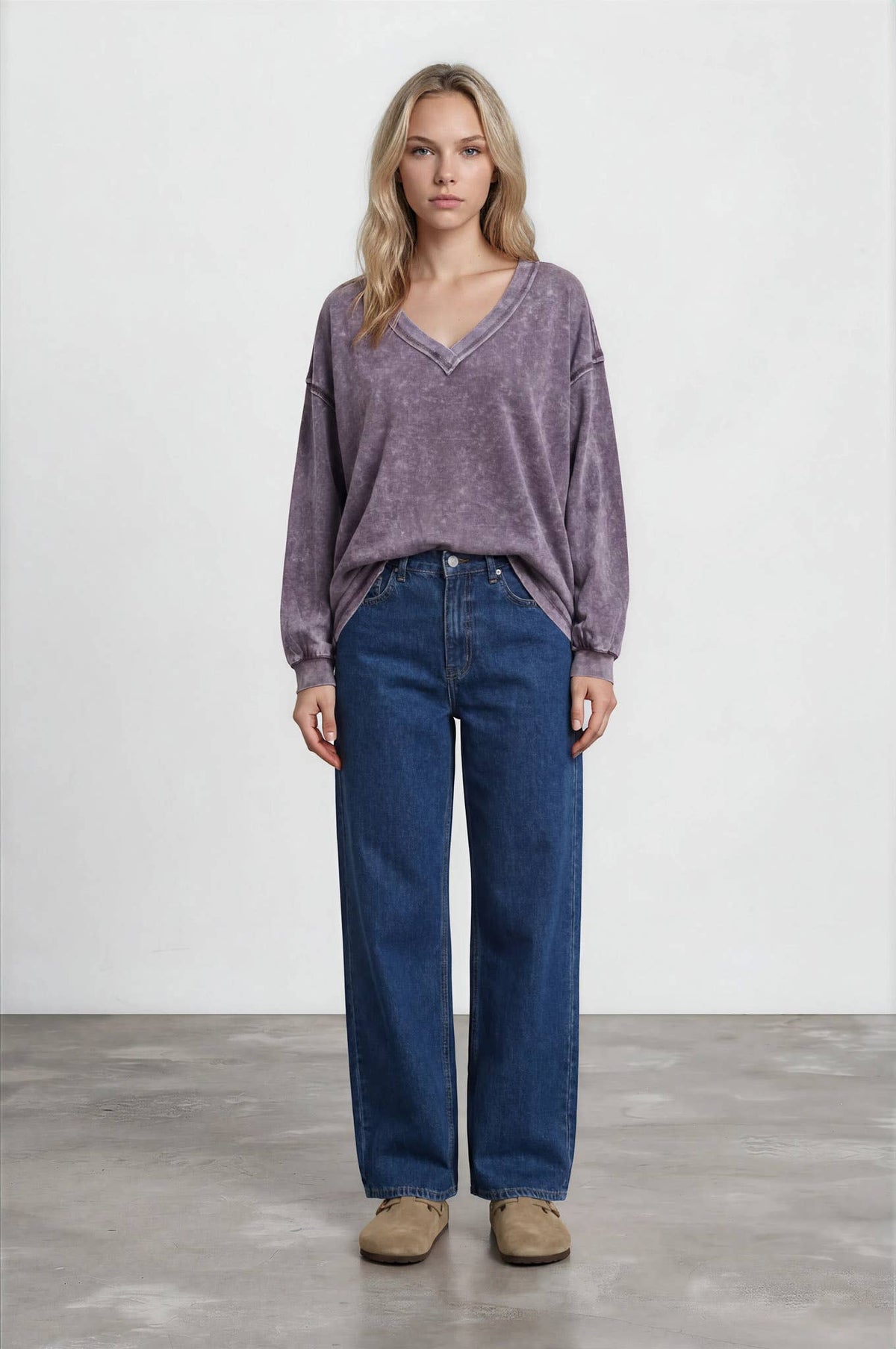 Full-length front view of the eggplant washed knit top