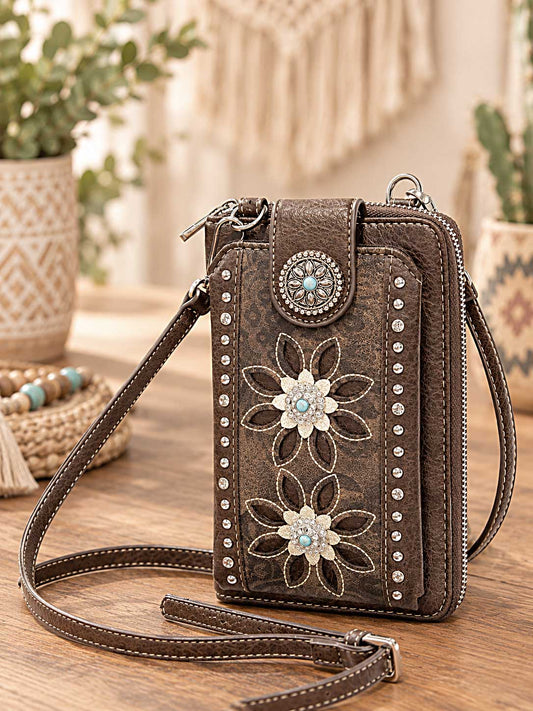 Brown crossbody wallet and phone holder with white floral cutwork, rhinestones and a turquoise-style clasp