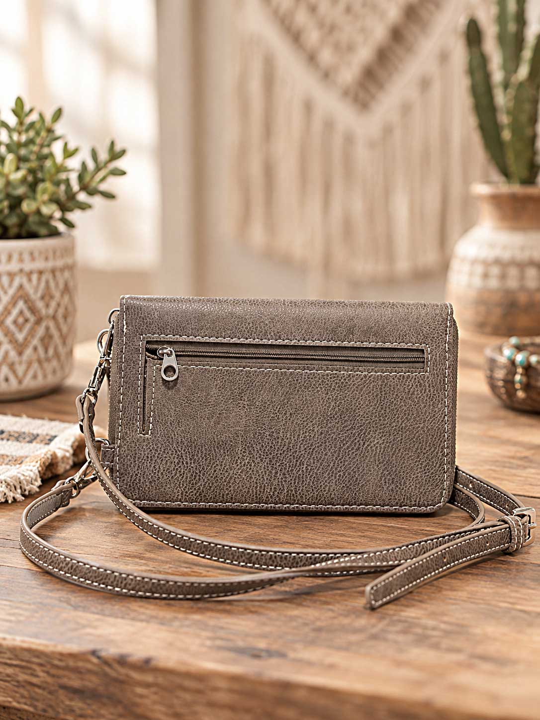 Back view of a similar MC phone wallet showing a zip pocket