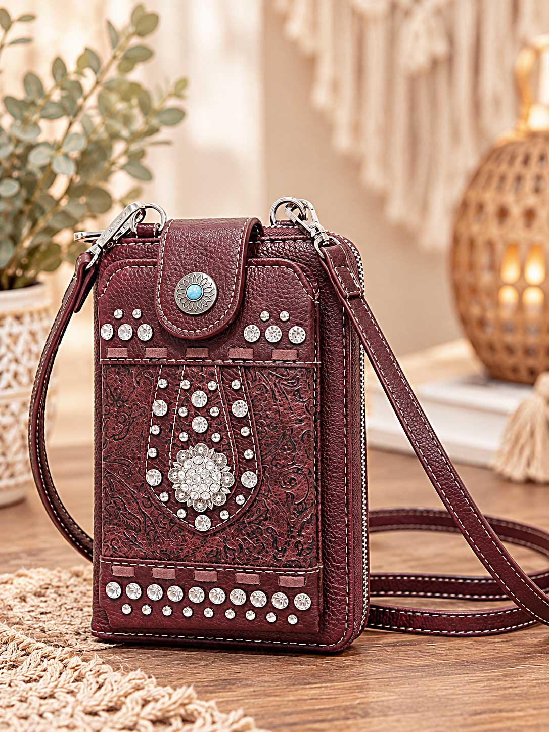 Burgundy studded crossbody phone wallet with silver studs, crystals and a turquoise-style floral clasp; this listing is black