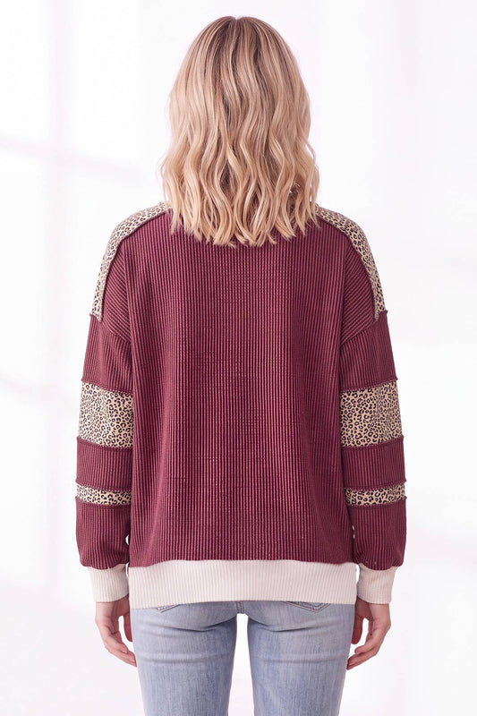Back view of the burgundy ribbed sweatshirt with leopard print sleeve panels