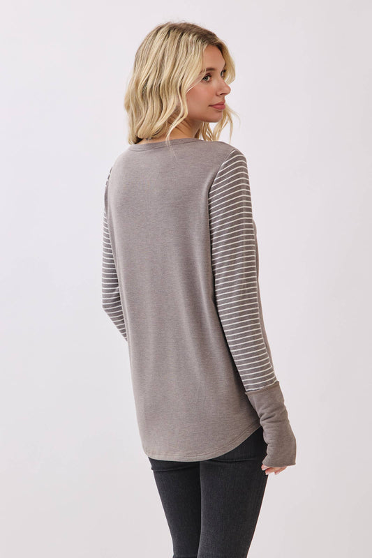 Back view of the taupe pullover with striped sleeves
