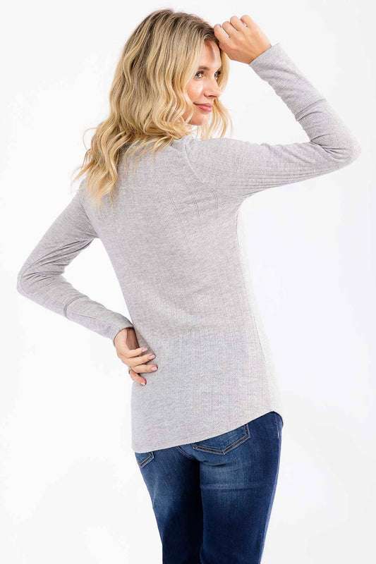 Heather grey ribbed button front top, side view with one hand in her hair