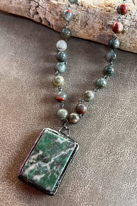 Short beaded necklace with a large rectangular green jasper pendant