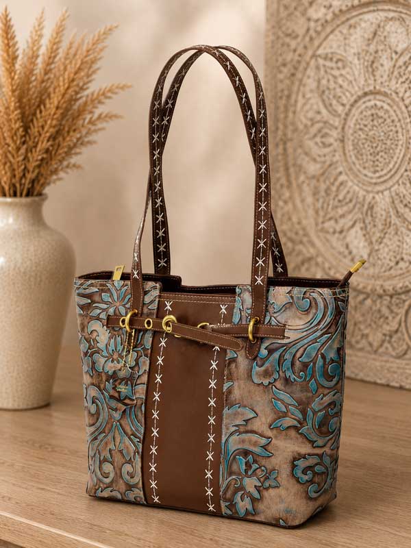 Turquoise and brown Nadi tooled embossed leather tote with floral tooling and stitched handles