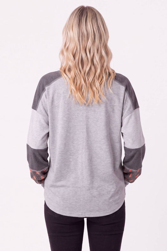 Back view of the heather grey pullover with charcoal shoulder panels