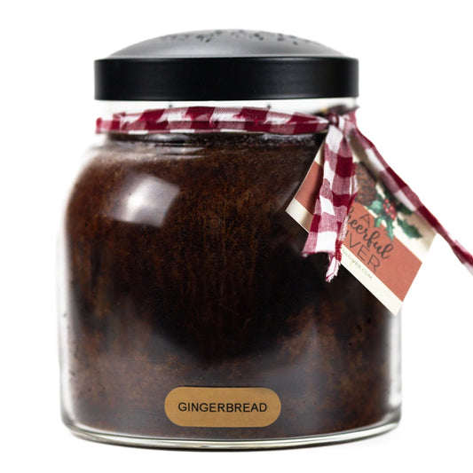 Gingerbread 34 oz dark brown jar candle with a black lid and red plaid ribbon
