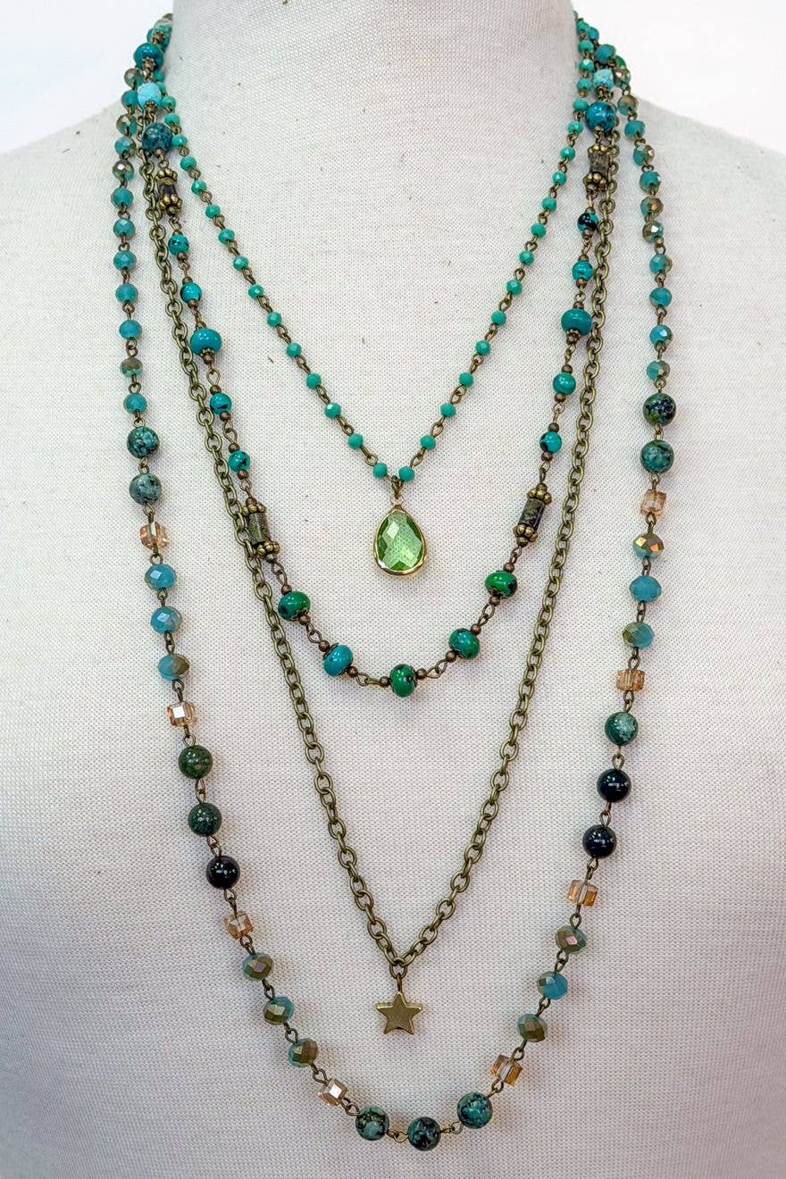 Four-layer green and turquoise beaded necklace with a green teardrop pendant and a bronze star charm