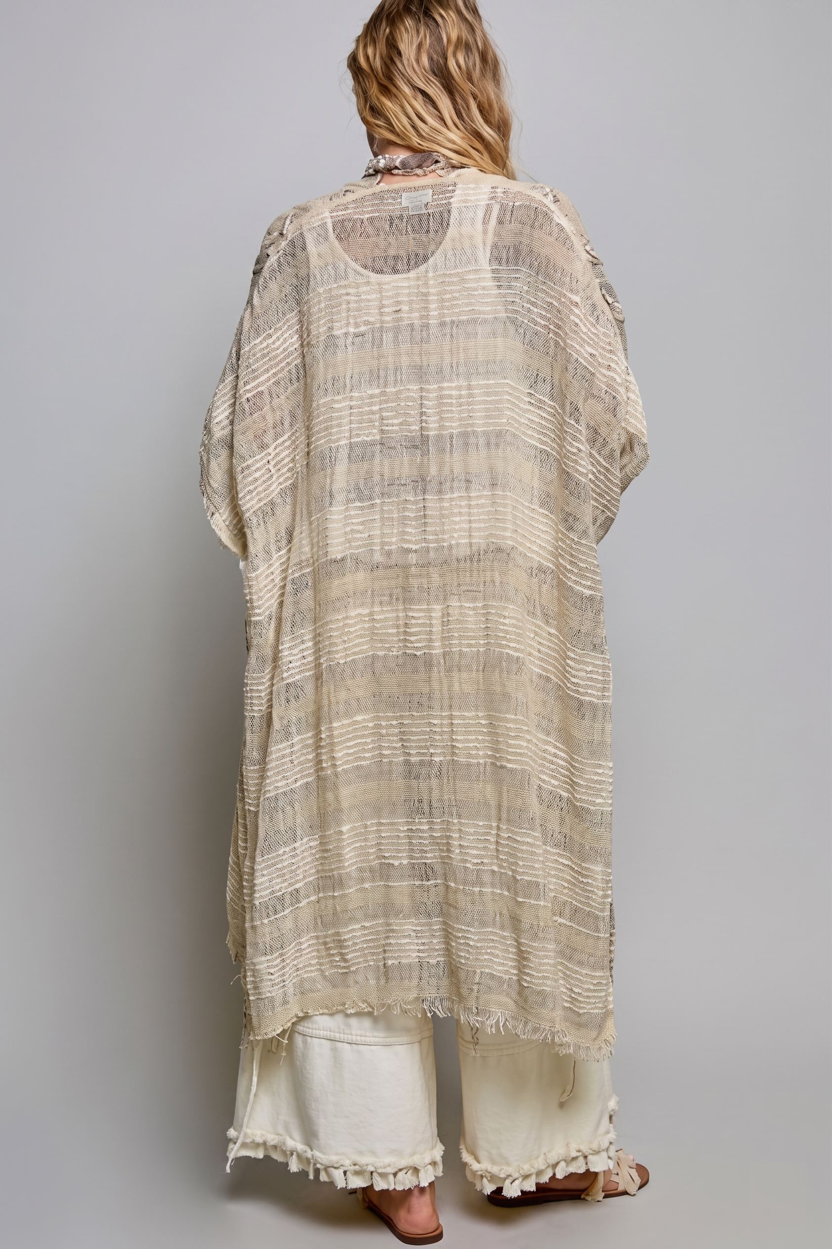 Back view of natural open-weave fringed boho kimono duster with striped texture