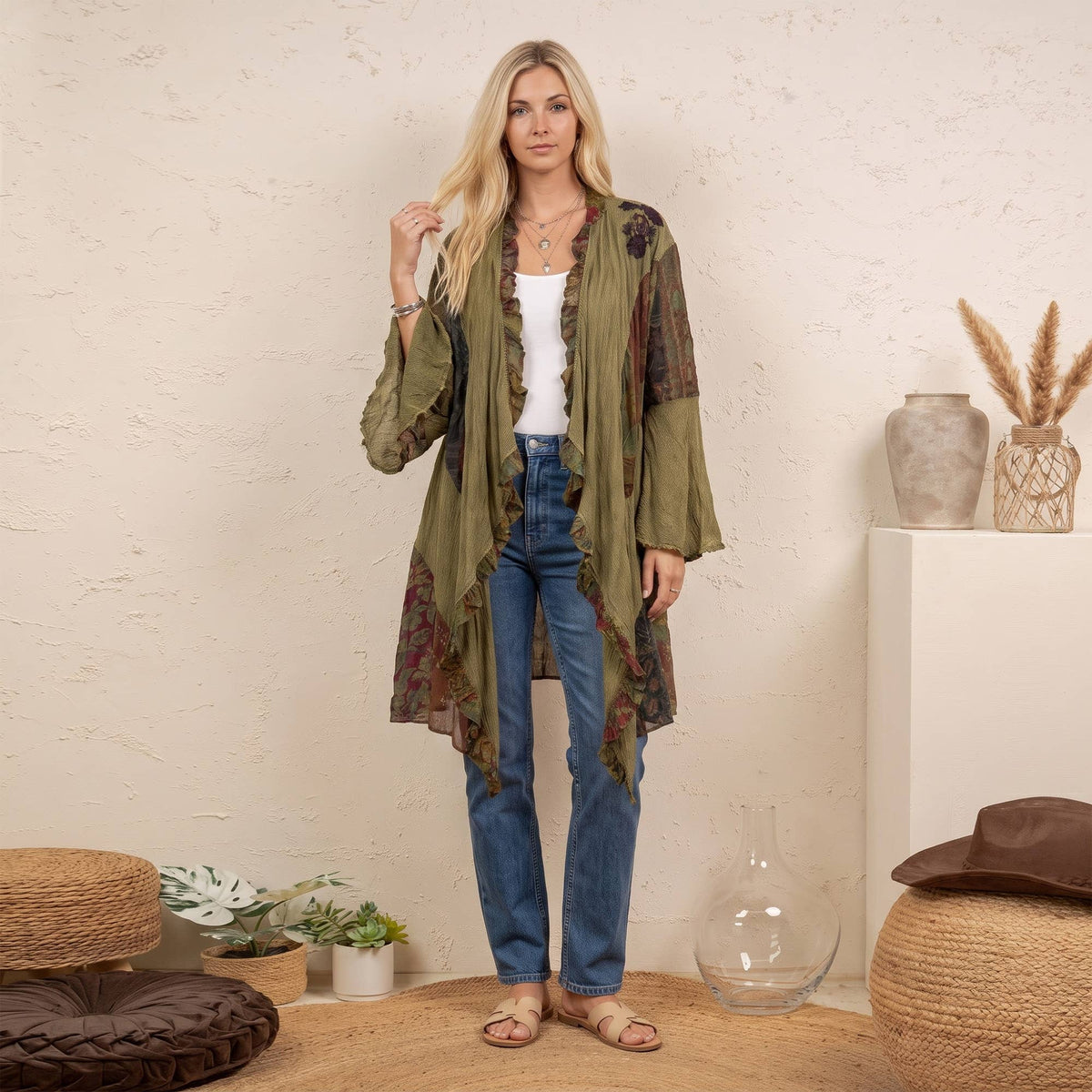 Woman wearing the gravel olive green patchwork ruffle kimono open over a white tank and jeans