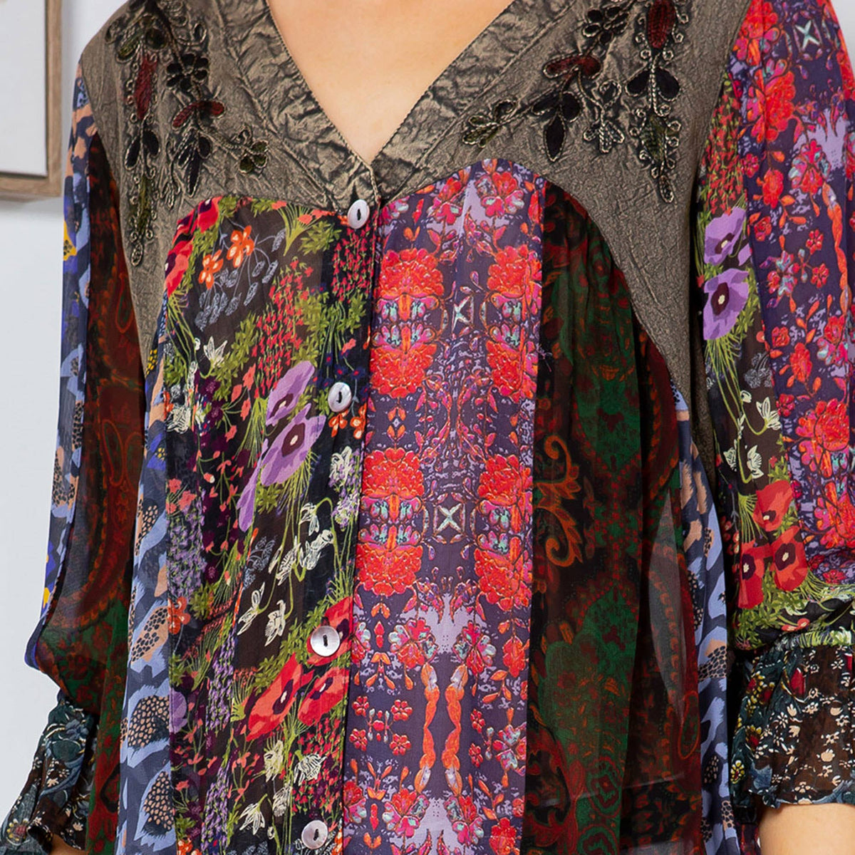 Close-up of the embroidered yoke and mix-matched batik prints on the gravel top