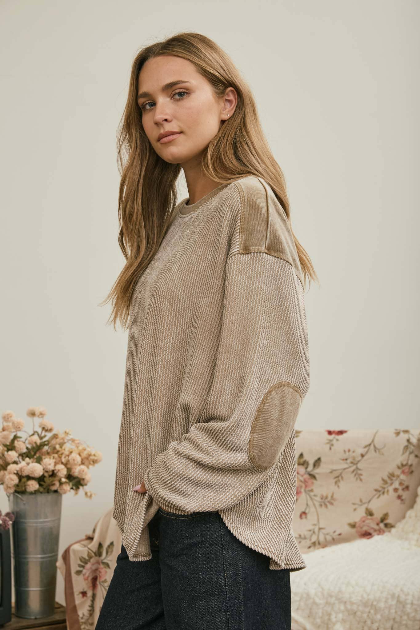Side view of the brown washed waffle knit boxy top with elbow patches