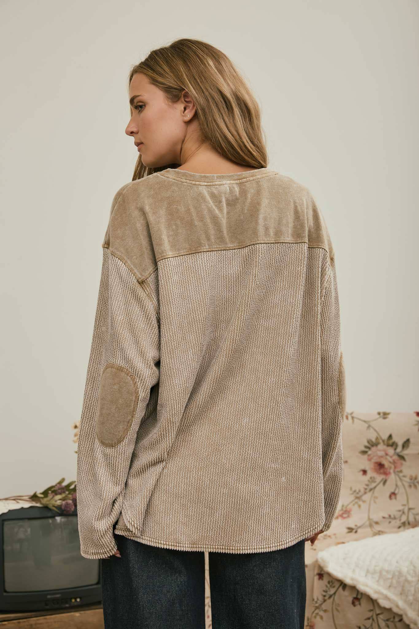 Back view of the brown boxy knit top