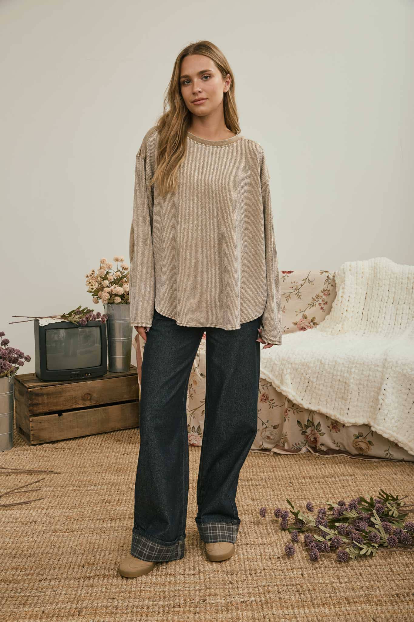Full-length look: brown boxy knit top with dark jeans