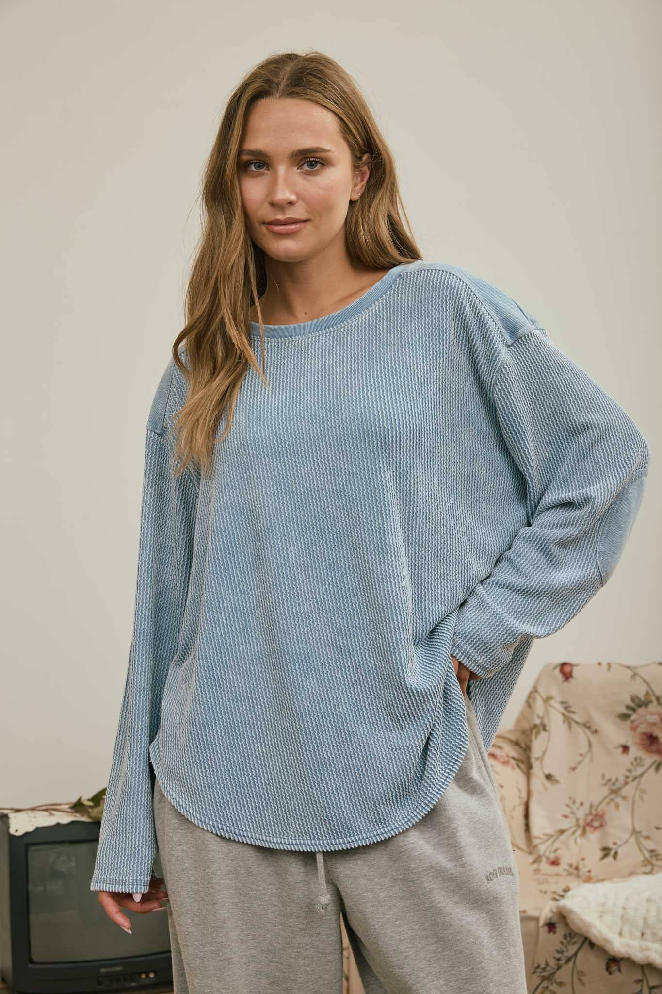 Front view of the light denim blue washed waffle knit boxy top