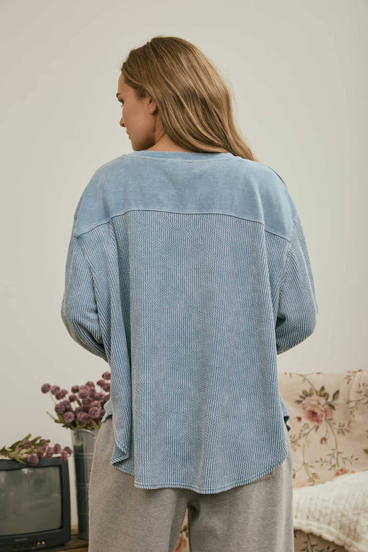 Back view of the light denim boxy knit top