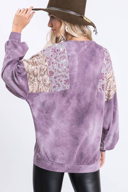 Back view of the purple tie dye bishop sleeve top showing the print panels