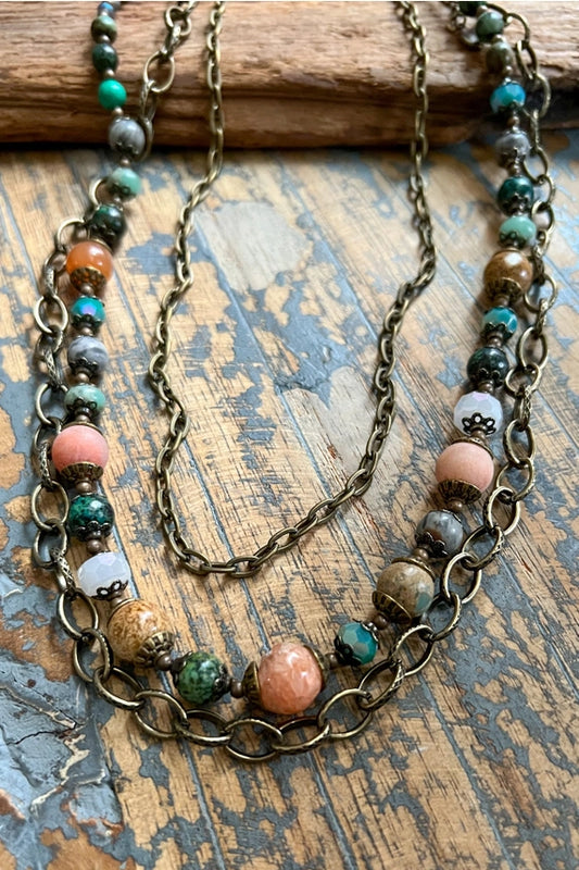 Carter layered necklace with two bronze chains and a beaded strand