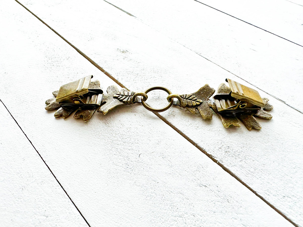 Back of the oak leaf clasp showing the bronze alligator grip clips
