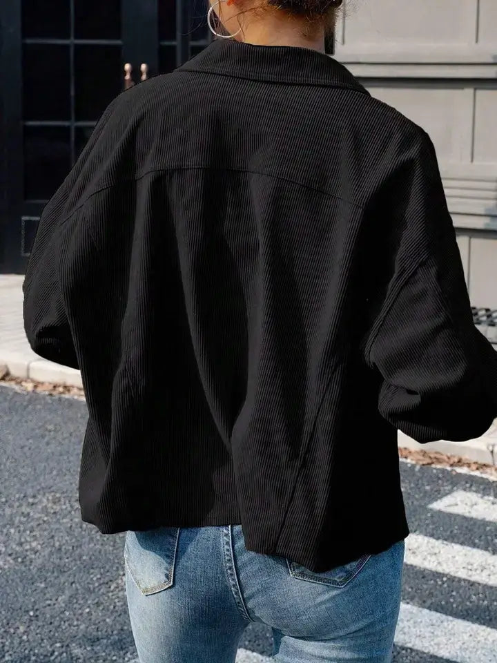 Back view of the black corduroy shacket showing the relaxed fit