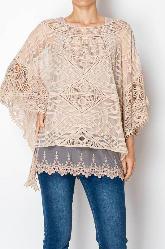 Taupe geometric crochet lace poncho top over a grey slip, front view
