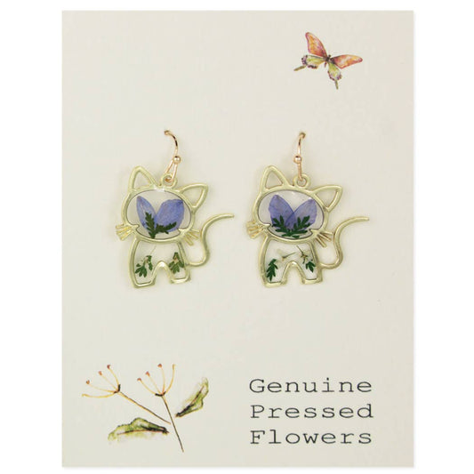 Pair of gold tone cat shaped earrings with genuine blue dried flowers on a display card