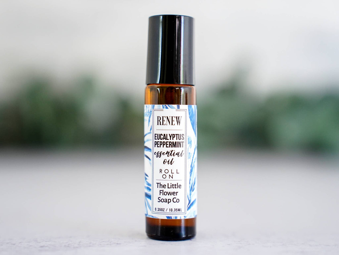 Renew eucalyptus and peppermint essential oil roll-on in a glass bottle for everyday aromatherapy