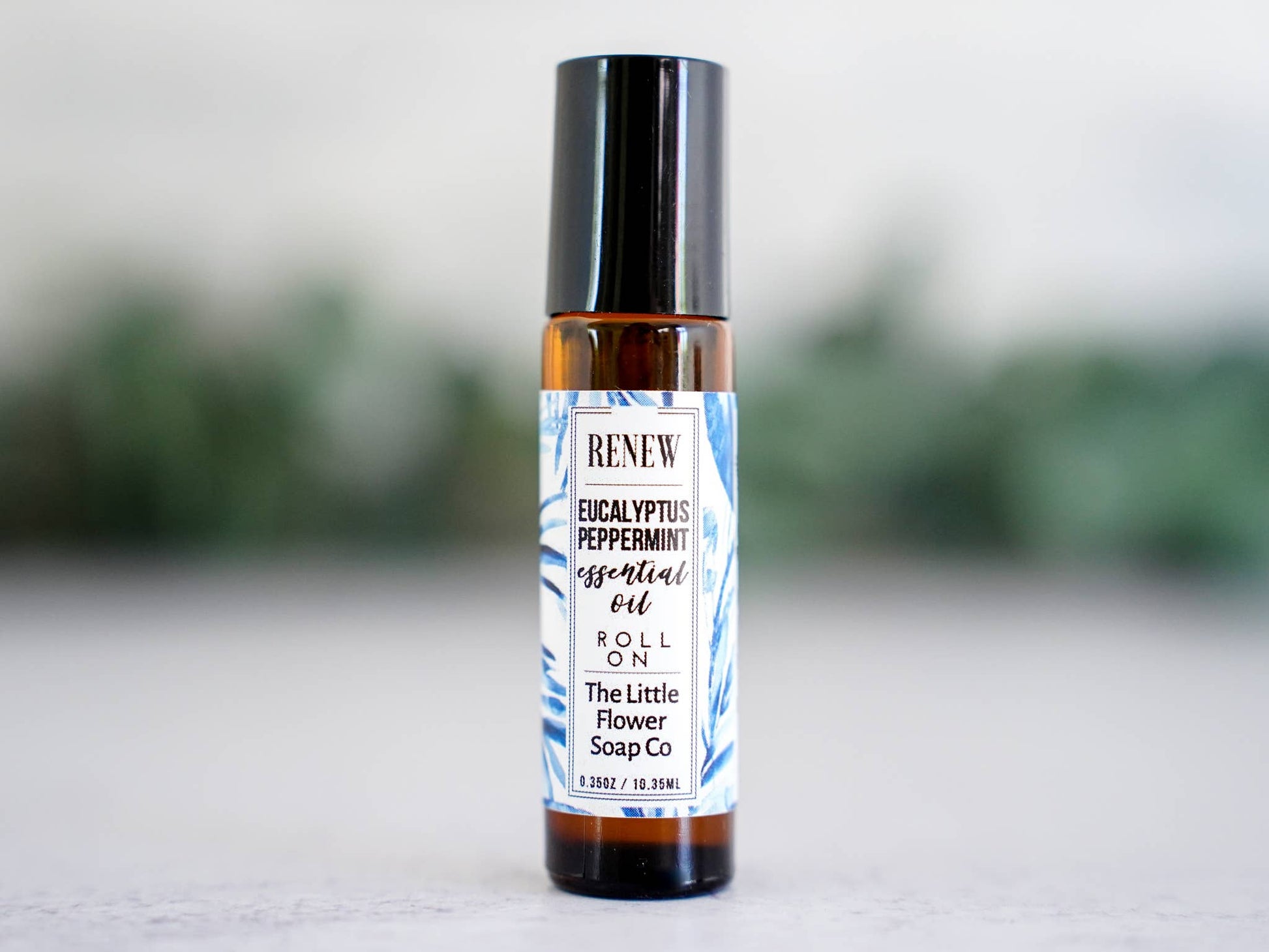Renew eucalyptus and peppermint essential oil roll-on in a glass bottle for everyday aromatherapy