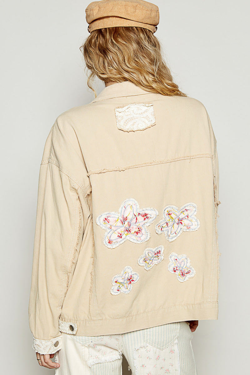 Back view of the cream floral applique jean jacket with lace detail by Pol Clothing