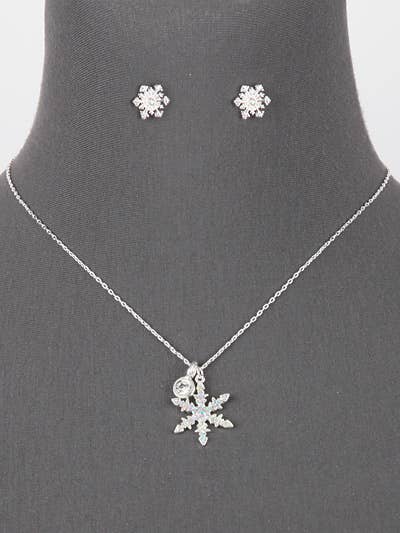 Snowflake necklace and post earrings on a gray neck form