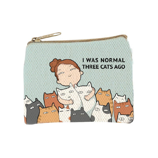 Pale mint zip coin purse printed with an illustrated woman surrounded by cats and the words I was normal three cats ago