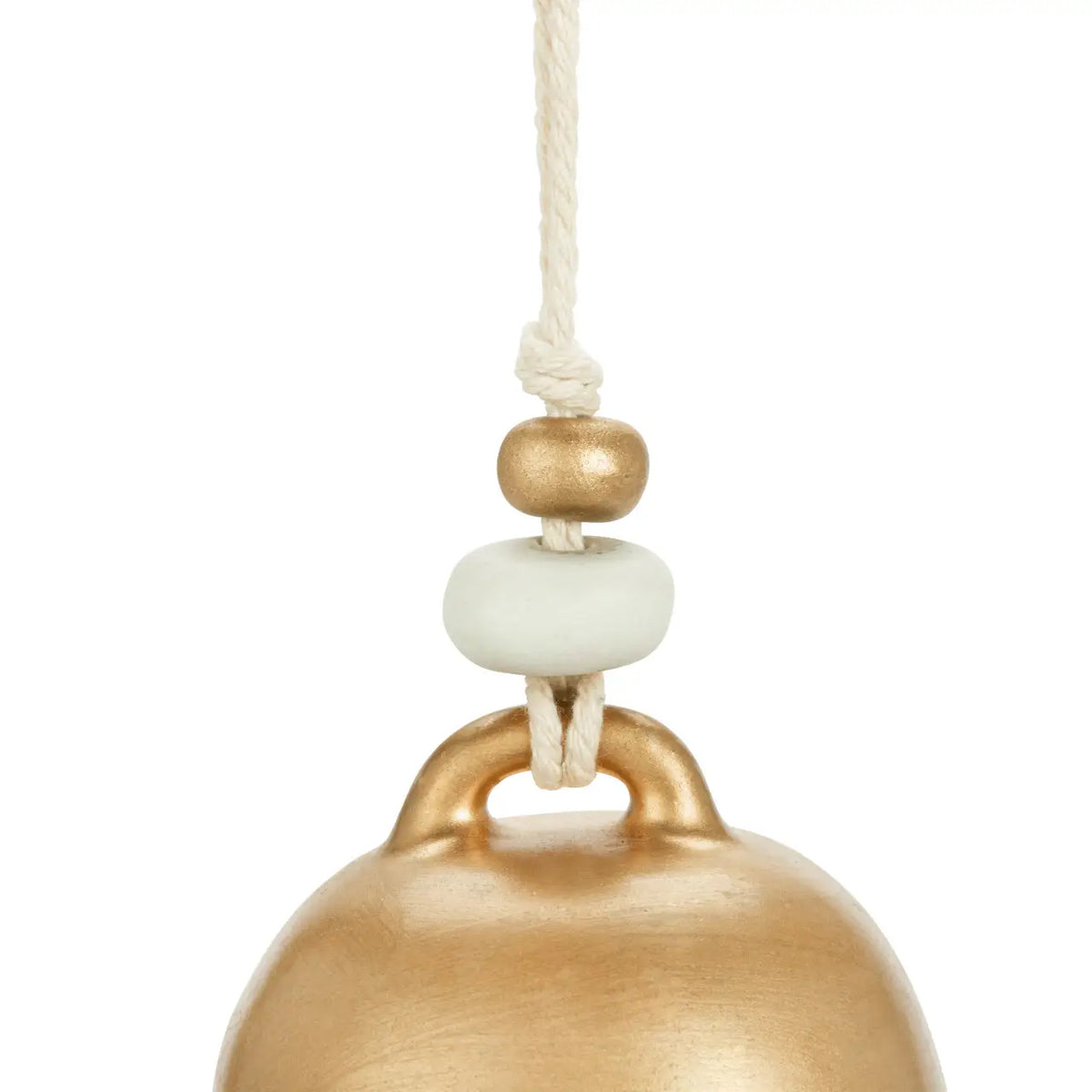 Close-up of the gold Blessed holiday bell with wooden and white beads