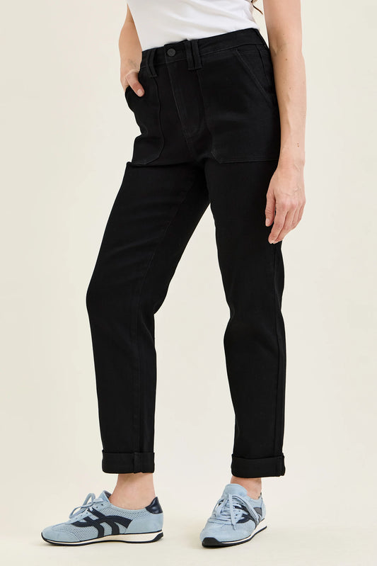 Front view of jet black high-waist slim straight jeans with a double rolled cuff