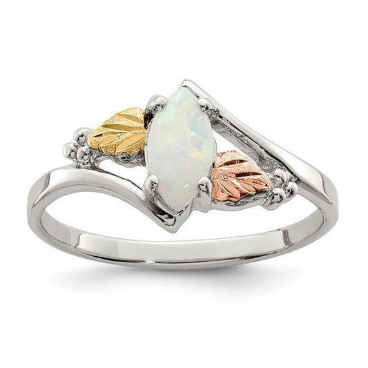 Landstrom's Black Hills sterling silver ring set with a marquise lab created opal, flanked by 12K green gold and rose gold leaves