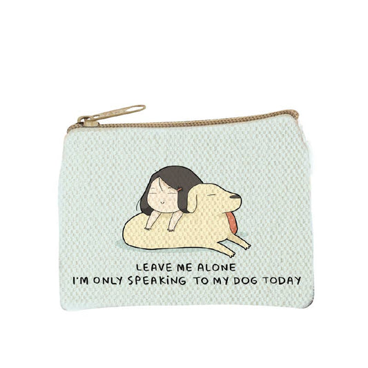 Pale mint zip coin purse printed with a woman lying nose to nose with her dog and the words leave me alone, I'm only speaking to my dog today