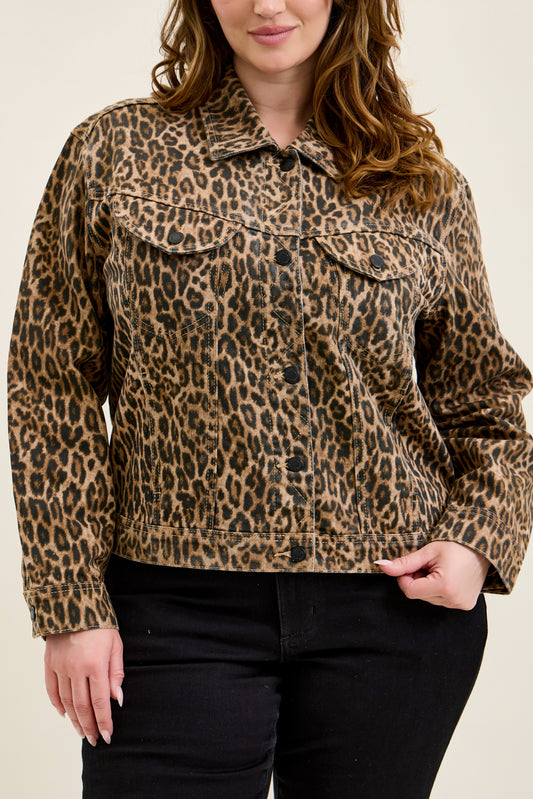 Plus size model wearing a leopard print rigid denim trucker jacket, front view