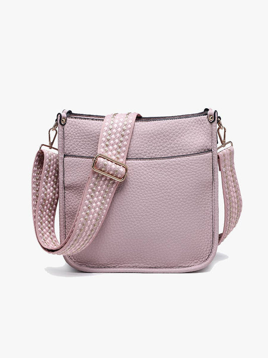 Pastel purple vegan leather crossbody bag with top-zip closure and a removable guitar strap