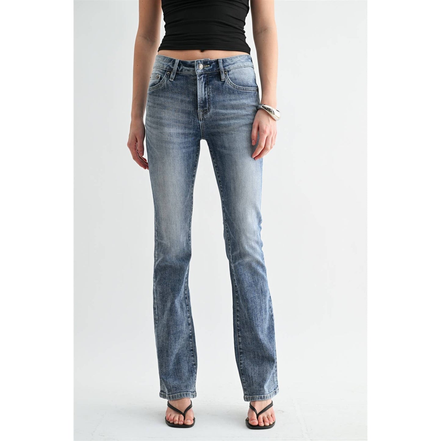 Mica bootcut jeans photographed from the waist down, showing the mid rise waistband and the 18 inch leg opening