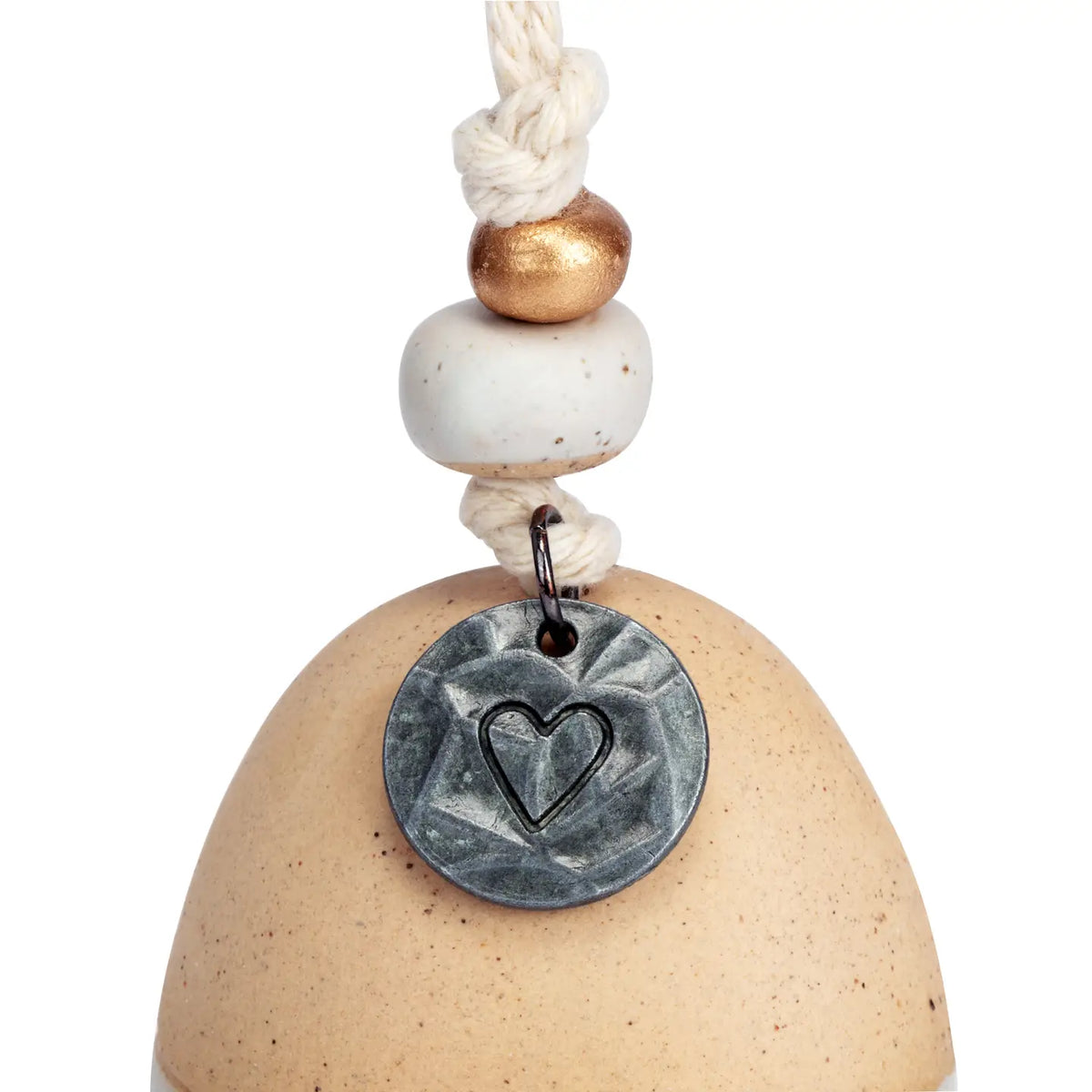 Close-up of the metal heart medallion on the Remembrance bell cord