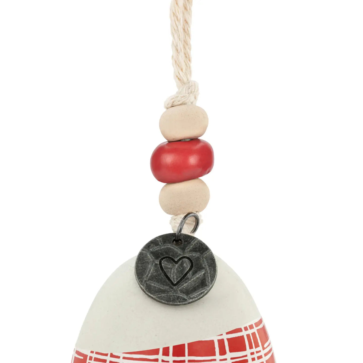 Close-up of the white Family holiday bell with red plaid band, bead and medallion