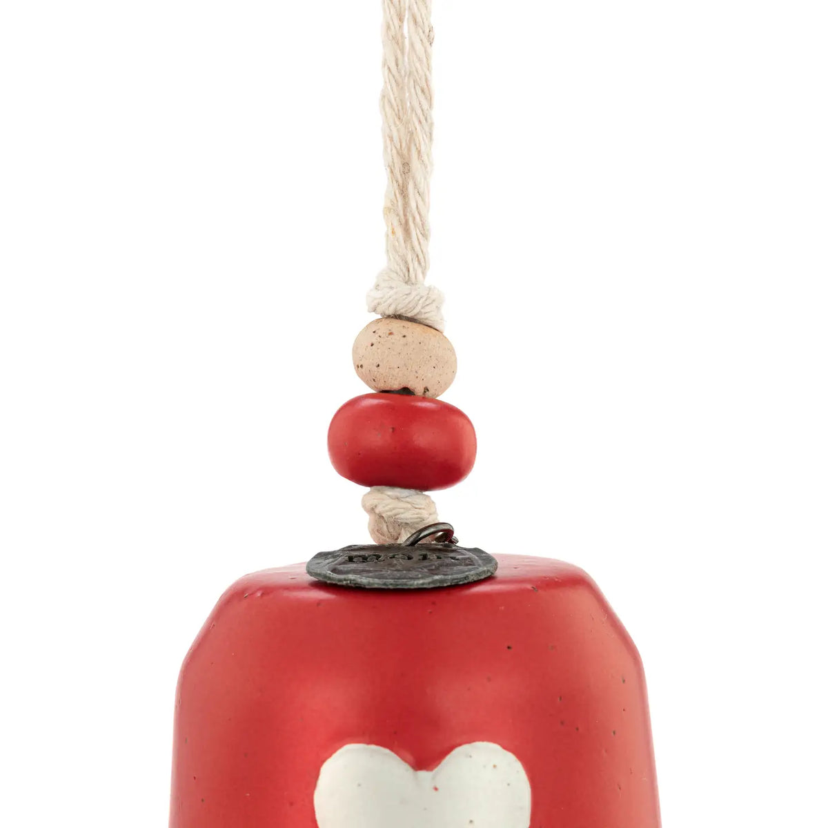 Close-up of the white heart on the red Mini Inspired Holiday Bell