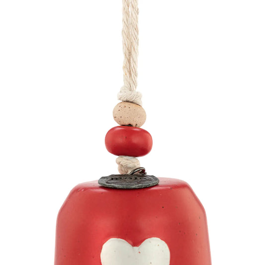 Close-up of the white heart on the red Mini Inspired Holiday Bell